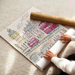 May include: Watercolor illustration of London landmarks, including Big Ben and red double-decker buses. A rolled-up poster and a print are on a light-colored rug. The artwork features a whimsical style with soft colors.