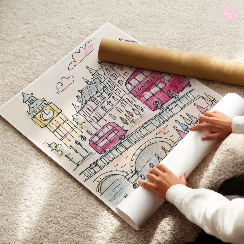 May include: Watercolor illustration of London landmarks, including Big Ben and red double-decker buses. A rolled-up poster and a print are on a light-colored rug. The artwork features a whimsical style with soft colors.