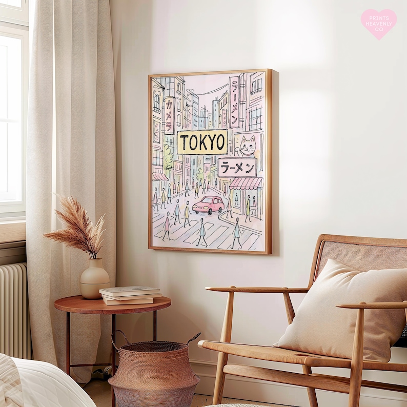 May include: A framed art print depicting a street scene in Tokyo. The artwork features a pink car, pedestrians, and Japanese signage, including the word "TOKYO" and "ラーメン". The color palette includes soft pinks, blues, and greens, with a wooden frame.
