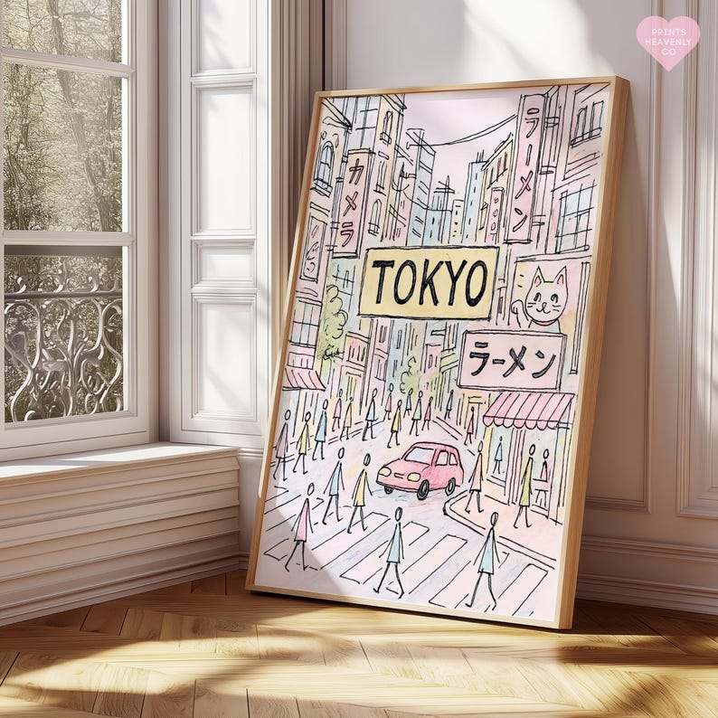 May include: A framed art print depicting a street scene in Tokyo. The artwork features a pink car, pedestrians crossing a street, and Japanese text. The word "TOKYO" is prominently displayed in a yellow sign. The print has a light wood frame.