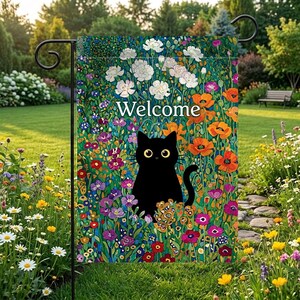 May include: A garden flag featuring a black cat with yellow eyes, surrounded by colorful flowers. The flag has the word "Welcome" in white text. The background is a vibrant mix of orange, white, purple, and green.