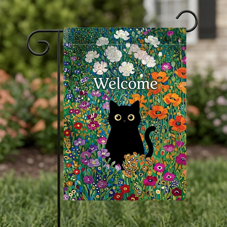 May include: A garden flag featuring a black cat amidst a vibrant floral design. The flag reads "Welcome" in white lettering. The flowers include white, orange, purple, and yellow blooms, set against a green background.