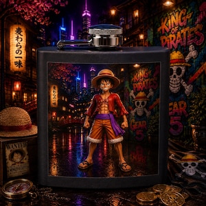 May include: A black metal flask featuring a graphic of the anime character Monkey D. Luffy in a straw hat, red vest, and orange shorts, set against a vibrant city street background with the text King of Pirates and Gear 5 visible.