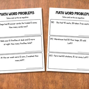 May include: Two white worksheets with math word problems. The text "MATH WORD PROBLEMS" is at the top of each sheet. Problems include subtraction and addition questions. The worksheets are on a wooden surface.