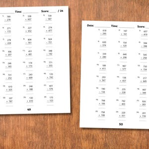 May include: Two white worksheets with math problems are displayed on a wooden surface. Each sheet has columns for date, time, and score, with a score out of 24. The worksheets contain addition and subtraction problems.