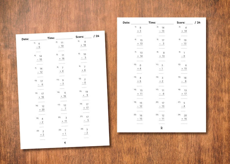May include: Two white worksheets with math problems, including addition and subtraction, are displayed on a wooden surface. The worksheets have sections for date, time, and score. The score is out of 24.