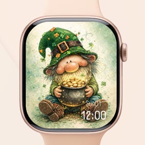 May include: A digital watch face displays a whimsical leprechaun holding a pot of gold coins. The leprechaun wears a green hat adorned with shamrocks. The watch face has a light green background with the date and time displayed at the bottom.