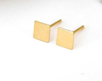 Gold square stud earrings in minimalistic style for casual everyday wear and formal events