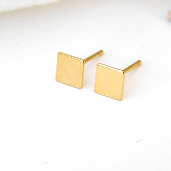 Gold square stud earrings in minimalistic style for casual everyday wear and formal events
