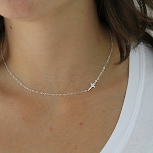Cross necklace for women with a sideways cross available in both sterling silver and 14kt gold fill