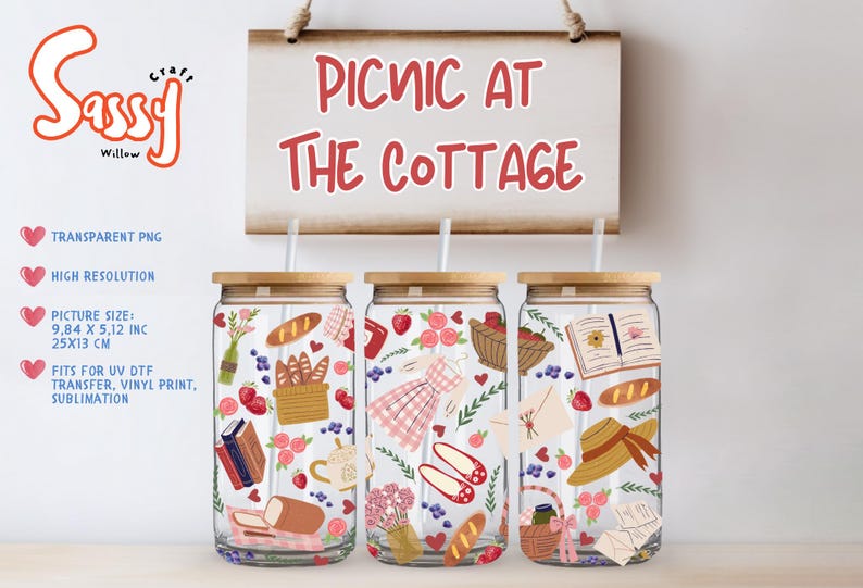 May include: Three glass tumblers with wooden lids and straws, decorated with picnic-themed illustrations. A sign above reads "Picnic at the Cottage." The tumblers feature images of bread, strawberries, and picnic baskets. The picture size is 9.84 x 5.12 inches (25x13 cm).