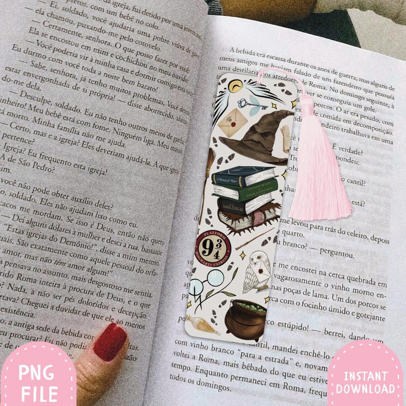 May include: A decorative bookmark with a fantasy theme, featuring a sorting hat, books, an owl, and a cauldron. The bookmark has a pink tassel and is placed on an open book.