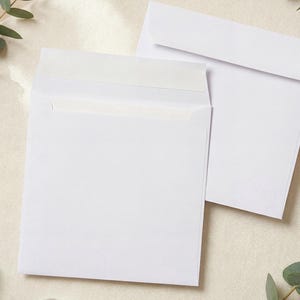 May include: Two square white paper envelopes with a straight flap design. One envelope is positioned with the flap open, revealing a strip of adhesive, while the second envelope is placed behind it with the flap folded down in a closed position.