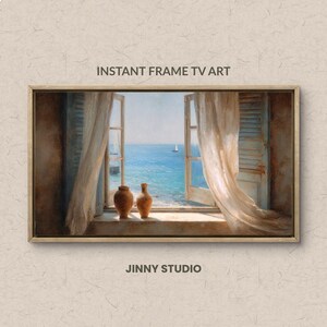 May include: A framed digital art print of a coastal scene. The artwork shows an open window with sheer curtains, overlooking a blue sea and a sailboat. Two brown vases sit on the windowsill. Text reads "INSTANT FRAME TV ART" and "JINNY STUDIO".