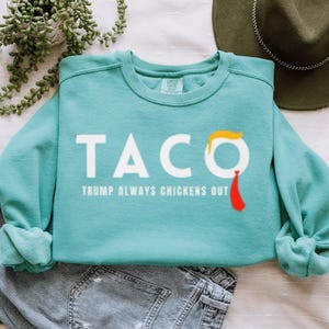 Funny Anti-Trump TACO Sweatshirt – “Trump Always Chickens Out” Political Graphic Pullover