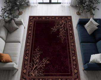 Puede incluir: Una alfombra rectangular burdeos con borde floral y detalles en las esquinas. La alfombra presenta un campo central burdeos oscuro, enmarcado por un borde detallado en un tono más claro. Patrones florales decorativos adornan las esquinas y los bordes.