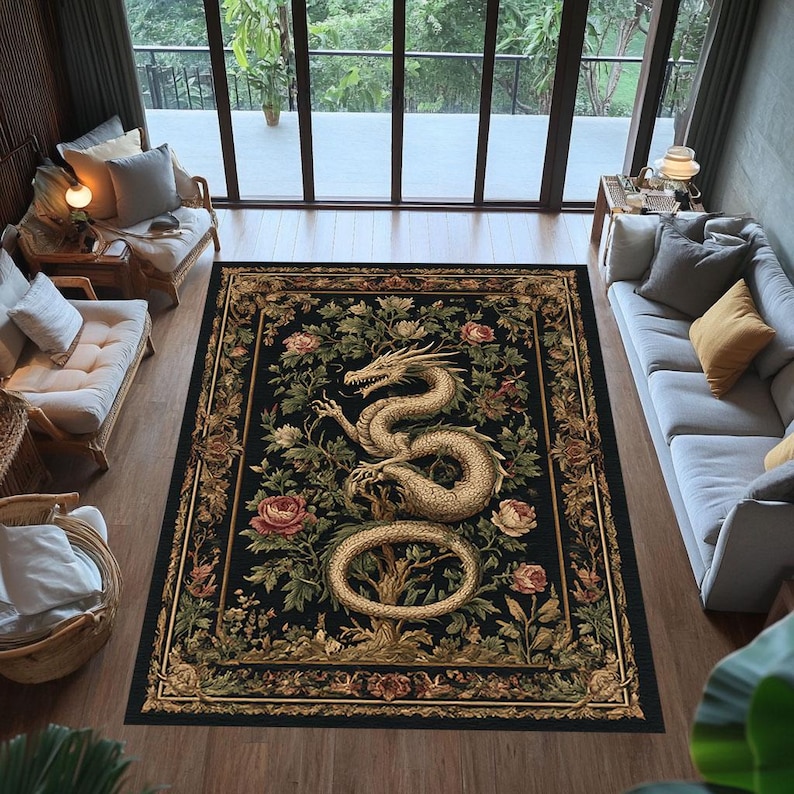 May include: A rectangular black area rug with a detailed design featuring a golden dragon, pink roses, and green foliage. The rug has a decorative border and is placed in a living room setting with natural light.