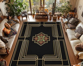 May include: A black rectangular area rug with a gold geometric design. The rug features a central medallion with red, green, and gold floral patterns. The rug is placed on a hardwood floor in a living room setting.