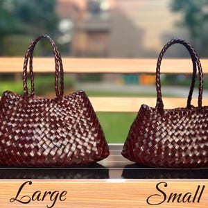 May include: Two woven brown tote bags, one large and one small, with braided handles. The bags are displayed on a wooden surface with the words "Large" and "Small" written below them.
