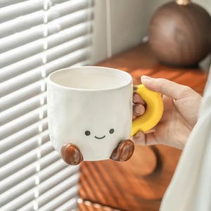 Cute Smiley Face Ceramic Mug with Banana Handle & Brown Feet, Kawaii Cartoon Pottery Coffee/Tea Cup, Unique Gift for Friends/Lovers on Etsy