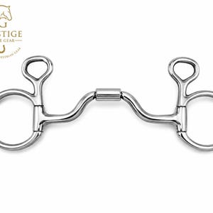 May include: A silver-coloured metal horse bit featuring a central barrel-shaped joint, curved shanks, and two large circular rings on each side. The logo for Prestige Horse Gear is visible in the upper left corner with text and a horse head icon.