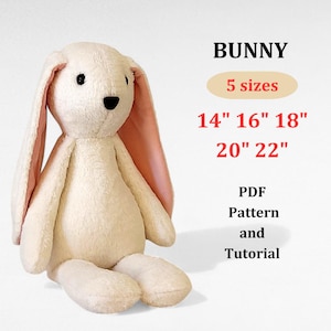 May include: A plush bunny in cream with pink inner ears, sitting upright. The image includes text indicating the bunny is available in five sizes: 14", 16", 18", 20", and 22". The text also mentions a PDF pattern and tutorial.