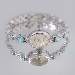 Women’s elegant bracelet watch, gold or silver with blue stones, jewelry style quartz watch