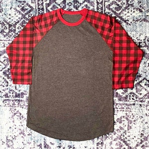 Maroon Buffalo Plaid Sleeve 3/4 Raglan Shirt with Dark Heather Grey/Gray Body. Shirt has a longer length and rounded hem