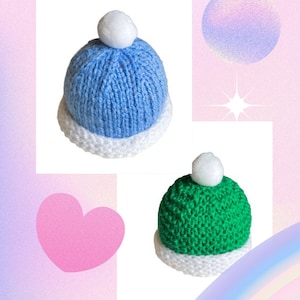 May include: Two knitted hats with white pom-poms. One hat is blue and the other is green.