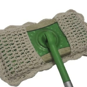 May include: A green and beige mop head with a crocheted cover. The mop head has a green head with a beige border and a green handle. The crocheted cover is beige and fits over the mop head.