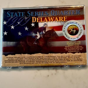 Moeda comemorativa de Delaware com caixa, quarto colorido apresentando história americana