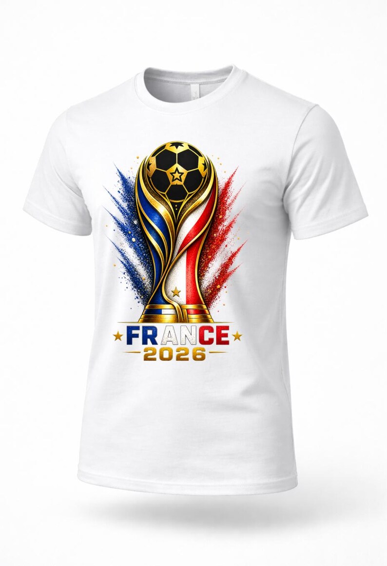 May include: White t-shirt featuring a gold and black soccer ball trophy design with blue, white, and red accents. The text "FRANCE 2026" is displayed below the trophy. A sporty design.
