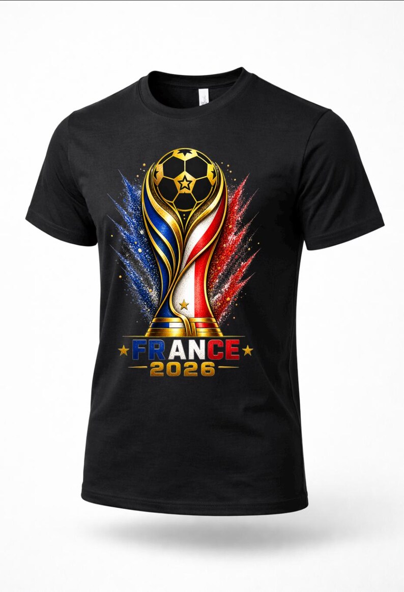 May include: Black t-shirt featuring a gold soccer ball trophy design with blue, white, and red accents. The text "FRANCE - 2026" is displayed below the trophy. The design is a celebration of soccer.