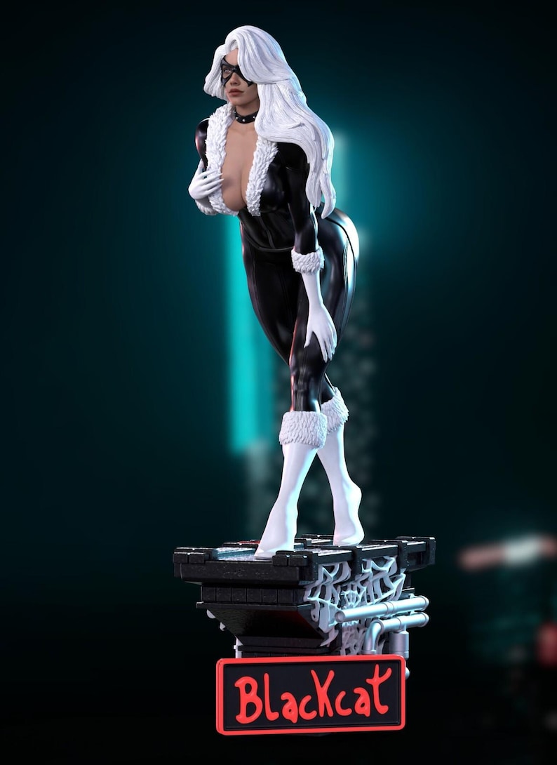 May include: A statue of Black Cat, a character from Marvel Comics, in a black catsuit with white fur trim and gloves. The figure has white hair and a black mask. The statue stands on a black base with the name "Blackcat" in red.