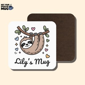 May include: A white square coaster with a cartoon sloth hanging from a branch, surrounded by hearts and stars. The text "Lily's Mug" is below the sloth. A brown coaster is behind it. The top left corner has the text "NOT YOUR REGULAR MUG".