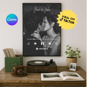 May include: Monochrome framed print of a couple kissing, with the names "Jane & John" in script. A music player interface graphic is overlaid on the image. A yellow starburst graphic reads "Viral on TikTok".