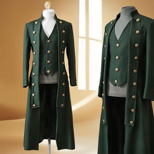 May include: A dark green, long coat and vest set with gold-colored buttons. The coat features a double-breasted design and a high collar. The vest has a V-neck and matching buttons. The set is displayed on a mannequin.