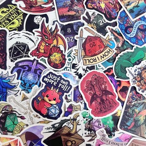 May include: A collection of colorful stickers featuring fantasy and gaming themes. Designs include dragons, dice, swords, and the text "HOW I ROLL" and "Just one more roll!". The stickers are in various shapes and sizes, with a mix of illustrations and text.