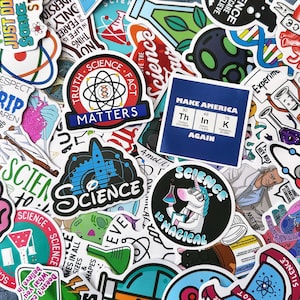 May include: A collection of science-themed stickers with various designs and text. Stickers include phrases like "Science Matters," "Science is Magical," and "Make America Again." The stickers feature images of lab equipment, a unicorn, and scientific symbols.