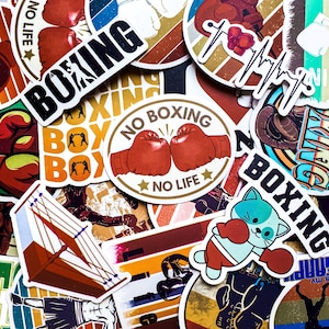 Puede incluir: Una colección de pegatinas coloridas con temática de boxeo. Las pegatinas presentan guantes de boxeo, la palabra "BOXING" y un gato de dibujos animados con guantes de boxeo. Algunas pegatinas tienen el texto "NO BOXING NO LIFE".