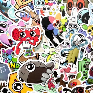 K&ouml;nnte beinhalten: Eine Sammlung farbenfroher Aufkleber im Cartoon-Stil mit verschiedenen skurrilen Charakteren und Designs. Die Aufkleber zeigen eine Reihe lebendiger Farben, darunter Rot, Blau, Gr&uuml;n und Gelb, mit kr&auml;ftigen Umrissen und ausdrucksstarken Gesichtern.