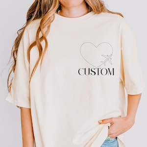 Wear Your Heart&#39;s Destination – Custom City Tee with Heart Plane Path, Perfect for Travelers & Love Across Miles