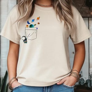 Astronaut Pocket Galaxy T-Shirt: Black Cotton Space Graphic Tee