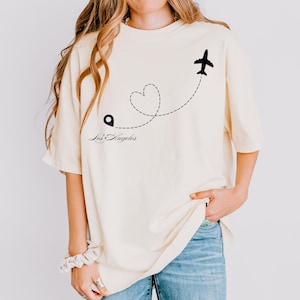 Custom City Love Tee – Personalized Comfort Colors Shirt, Heart Plane Graphic, Oversized Fit, Gift for Travelers & Long-Distance Lovers
