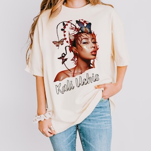 Kali Uchis Concert Tee – Comfort Colors Butterfly Graphic Shirt, Dreamy Fanwear, Oversized Fit, Latin Pop Festival Look