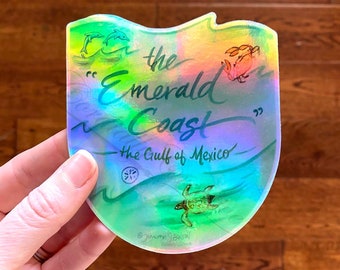 Emerald Coast sticker - holographic! - vinyl featuring the dolphin, a sea turtle, a crab and the waves of the beach on Florida's Gulf Coast