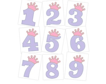May include: Nine purple numbers with pink crowns on top. The numbers are 1 through 9.