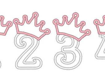 May include: Four numbers, 1, 2, 3, and 4, with pink crowns on top. The numbers are white and outlined in a darker shade of white.