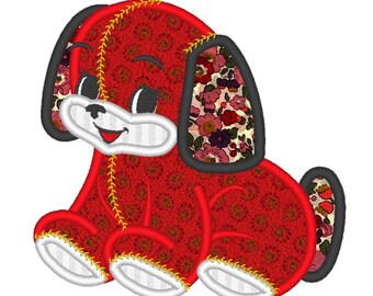May include: A red plush dog with a floral pattern on its ears and paws. The dog has a smiling face with black eyes and a white muzzle. Yellow stitching outlines the seams, adding a decorative touch to the stuffed animal.