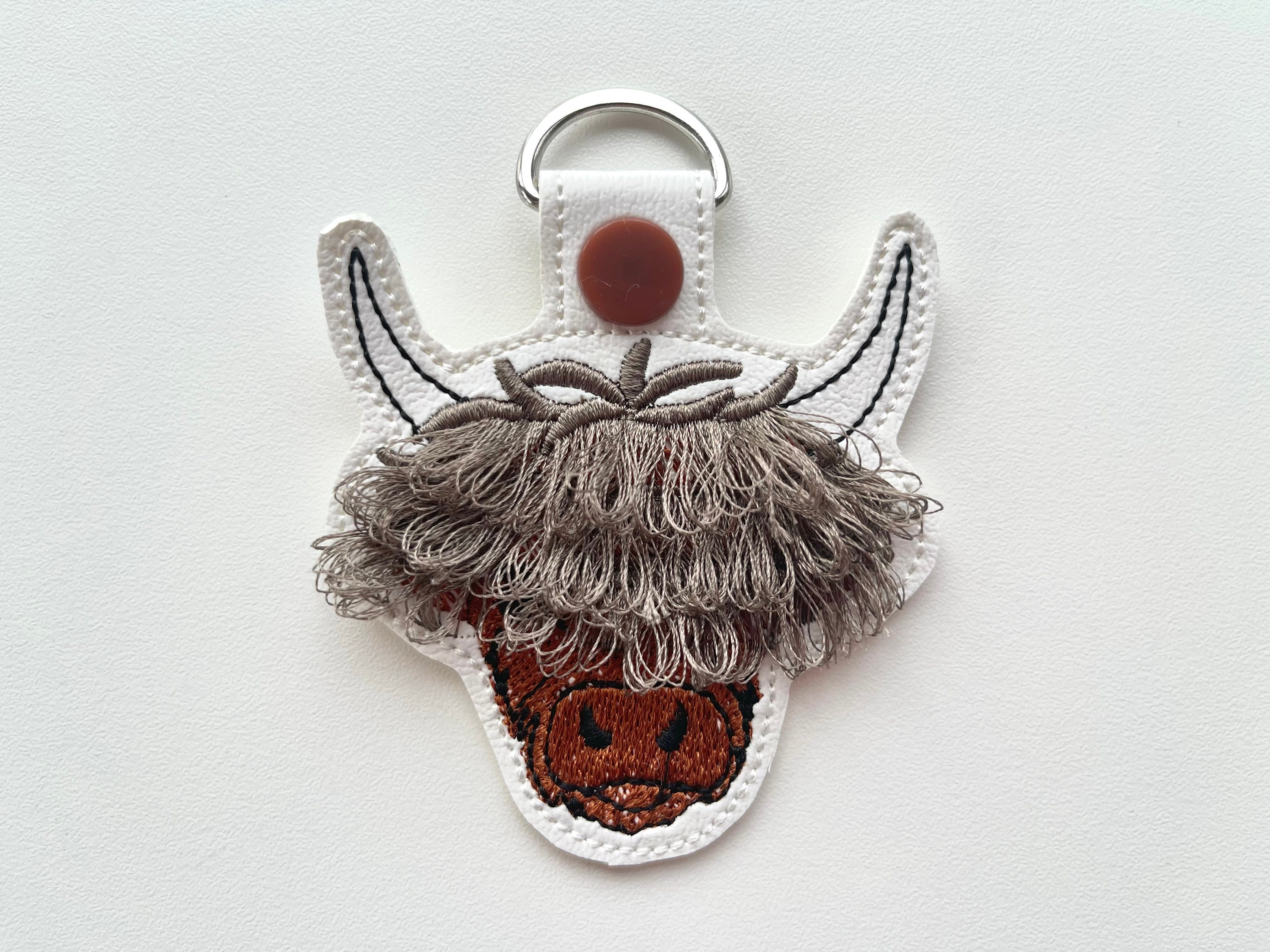 Fringed Highland cow keychain key fob snap tab in the hoop machine embroidery designs ITH project Awesome fluffy fur cow kids backpack tag